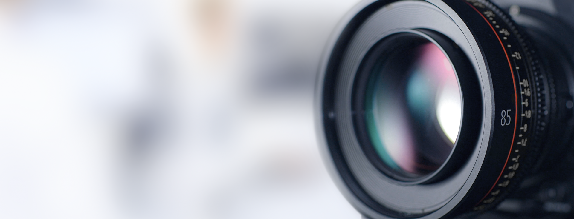 close-up of a camera lens with visible lens reflections